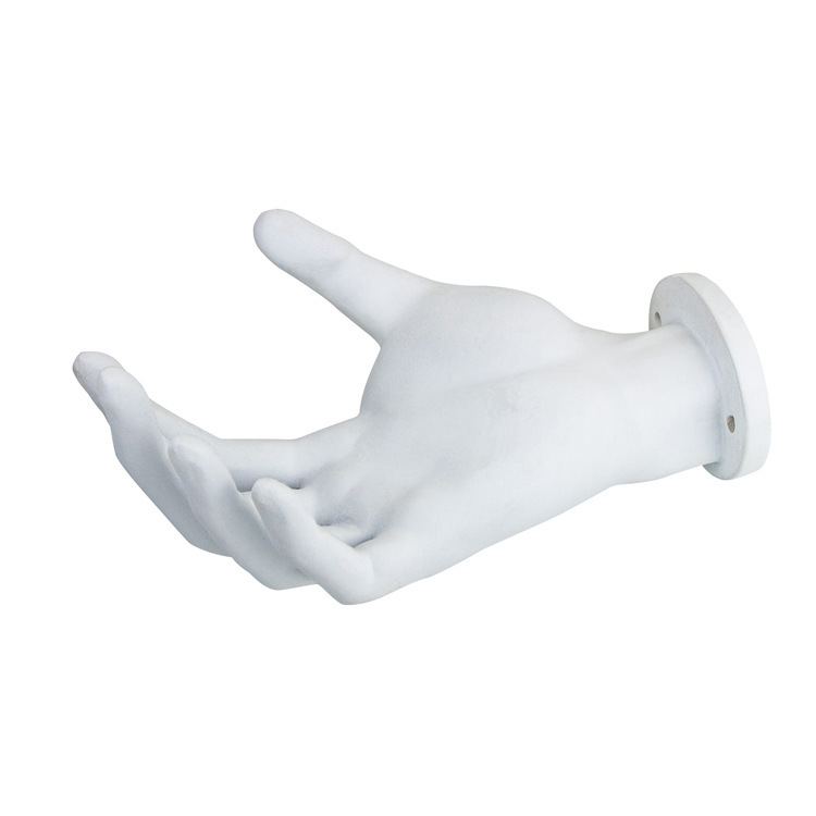 A 3D hand-shaped resin wall hanger holding a guitar.